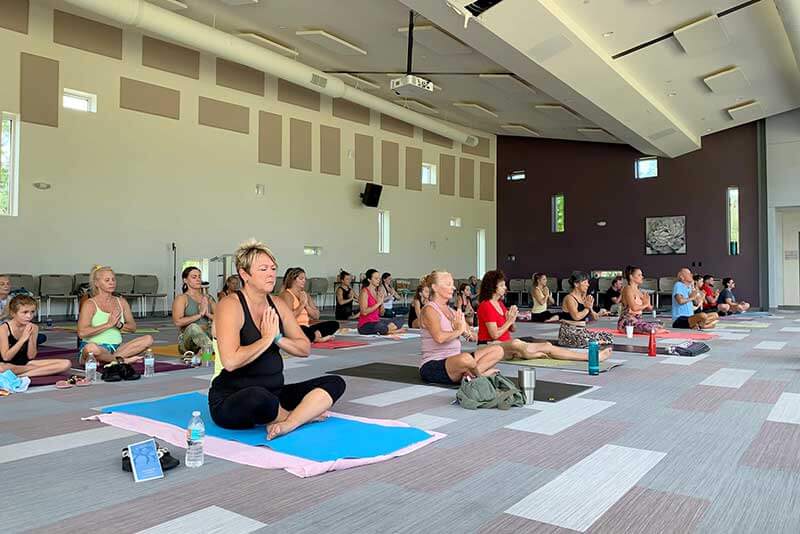 people taking a yoga class at yoga studio