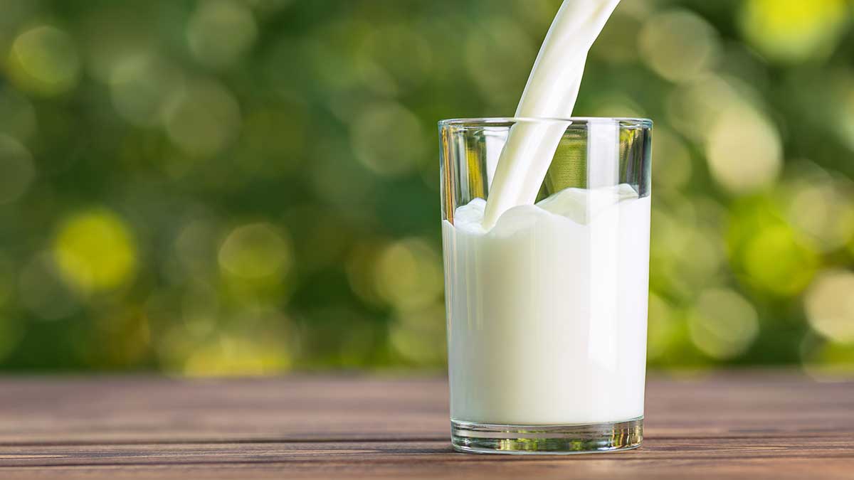 milk pouring into a glass