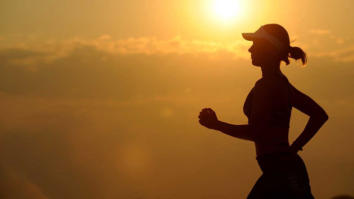 woman running at sunrise