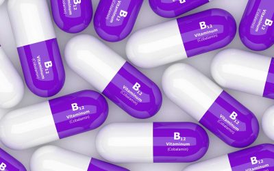 3d rendering of purple vitamin b12 capsules on a table