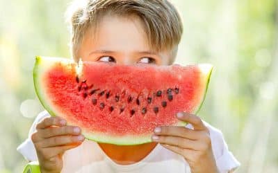 happy child eating watermelon