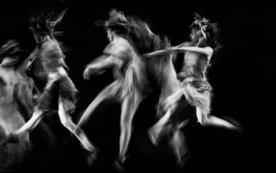 scenography of dancers dancing in black and white